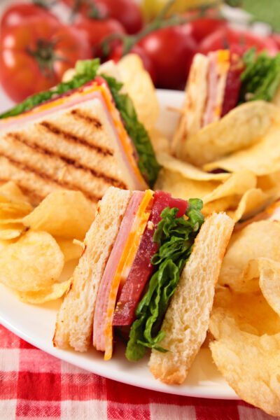 Summer picnic club sandwich ham and cheese, potato crisps